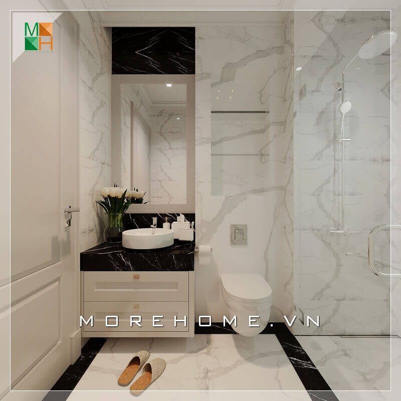 Tủ kéo gỗ được thiết kế thông minh và phù hợp với thiết kế tổng quan của căn phòng để chứa đồ dưới bồn rửa. Màu sắc của nó được lựa chọn để tương đồng với tone màu chính của phòng tắm, đó là trắng.